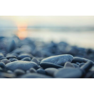 River Stones in Sunset Acrylic Print